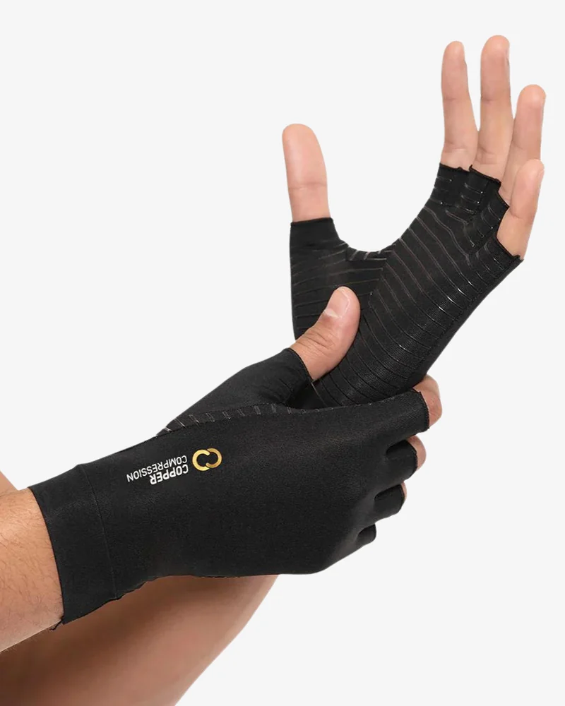 Copper Compression fingerless arthritis gloves in black, worn on a pair of hands